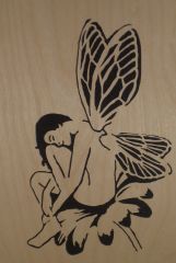 Nude Fairy Sitting On Flower