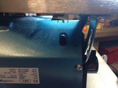 Hole for bottom blade clamp access