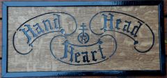 Hand, Head, Heart simulation of a carving on a door  in the Roycroft Inn