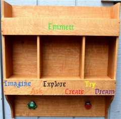 Child's shelf unit with embedded baked clay lettering