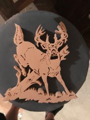Deer jumping over wood